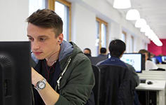 A student working on a computer in Boots Library