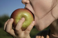 Student eating an apple