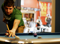 student playing pool