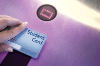 Someone swiping their student card